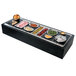 A Vollrath Miramar night sky resin adapter plate on a buffet line with different types of food in bowls.