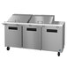 A large stainless steel Hoshizaki refrigerated salad prep table with wheels.