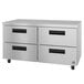 A stainless steel undercounter with four drawers.