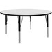 A Correll white round activity table with black legs.