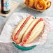 Two Nathan's Famous beef hot dogs in a basket.