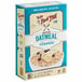 A box of Bob's Red Mill Gluten-Free Oatmeal packets with a bowl of oatmeal topped with bananas and blueberries.