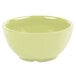 A close up of a GET Diamond Harvest Avocado Melamine Bowl with a green lid.
