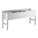 A stainless steel Regency underbar sink with three large compartments and two large drainboards.