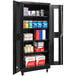 A black Hallowell metal mobile storage cabinet with safety-view doors and shelves full of products.