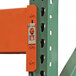 A close-up of a blue metal Vestil Pallet Racking frame post with a lock.