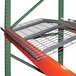 A metal grate on a metal Pallet Rack shelf.