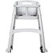 A white plastic Rubbermaid high chair with wheels.