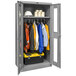 A grey metal Hallowell wardrobe cabinet with safety-view doors filled with clothes.