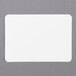 A roll of white rectangular labels with a gray border.