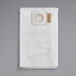 A white cloth bag with a white circle and a gold ring.