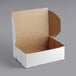 A white bakery box with a lid.