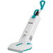 A white and blue Makita cordless upright vacuum cleaner.