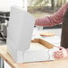 A person opens a white Half Sheet Cake Bakery Box.