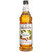 A Monin bottle of hazelnut syrup.