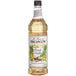 A case of 4 Monin French Vanilla Syrup bottles.