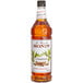 A Monin bottle of cinnamon syrup.