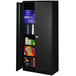 A black metal Tennsco storage cabinet with solid doors and shelves full of boxes.