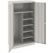 A light gray metal Tennsco combination cabinet with solid doors and shelves.