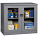 A dark gray Tennsco jumbo storage cabinet with C-Thru doors.