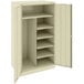 A white metal Tennsco combination cabinet with shelves.