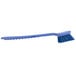 A Carlisle blue Sparta utility/pot scrub brush with a blue handle.