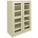 A putty Tennsco storage cabinet with C-Thru doors.