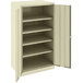 A Tennsco putty metal storage cabinet with shelves and solid doors.