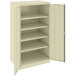 A beige Tennsco storage cabinet with solid doors.
