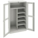 A light gray metal Tennsco combination cabinet with open doors and open shelves.