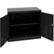 A black metal Tennsco storage cabinet with open doors.