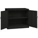 A black Tennsco jumbo storage cabinet with solid doors open.