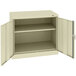 A beige Tennsco metal storage cabinet with open solid doors.