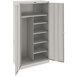 A light gray metal Tennsco combination cabinet with shelves.