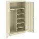 A beige Tennsco standard combination cabinet with solid doors and shelves.