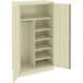 A beige Tennsco metal combination cabinet with shelves and solid doors.