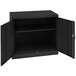 A black Tennsco metal storage cabinet with open doors.