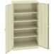 A beige metal Tennsco storage cabinet with solid doors.