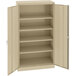 A tan Tennsco metal storage cabinet with open doors.