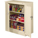 A white Tennsco storage cabinet with shelves full of boxes and cans.