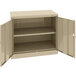 A tan Tennsco storage cabinet with solid doors.