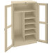 A tan Tennsco industrial storage cabinet with open C-Thru doors.