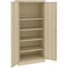 A tan metal Tennsco storage cabinet with solid doors.
