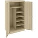 A tan metal Tennsco standard combination cabinet with solid doors and shelves.