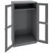 A dark gray metal Tennsco wardrobe cabinet with open doors.