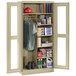 A beige Tennsco combination storage cabinet with open C-Thru doors.