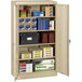 A Tennsco sand storage cabinet with solid doors filled with boxes.