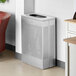 A silver rectangular Lancaster Table & Seating waste receptacle with holes.