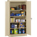 A Tennsco sand storage cabinet with many items on it.
