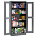 A large metal Tennsco storage cabinet with shelves full of products.